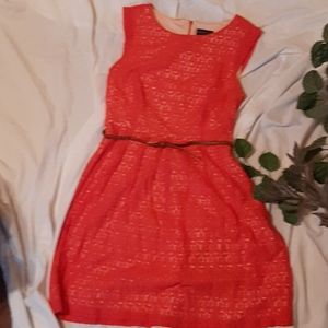 Sleeveless, lace overlay dress with braided belt.